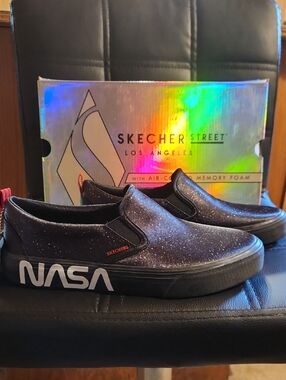 Women Skechers Black Slip-On Sneakers with NASA Graphic